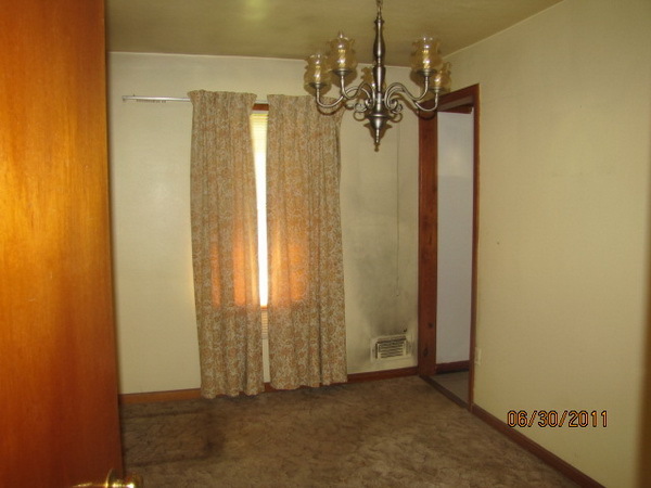1904 Meadowbrook Road Northwest Roanoke, VA 24017 - Photo 5 of 6 an empty room with a chandelier fan