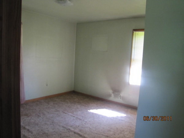 1904 Meadowbrook Road Northwest Roanoke, VA 24017 - Photo 6 of 6 an empty room with a window