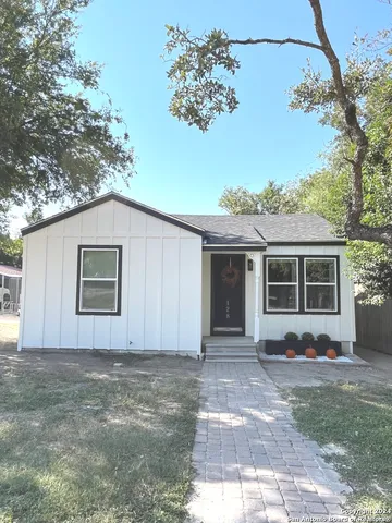 a house with trees in the background