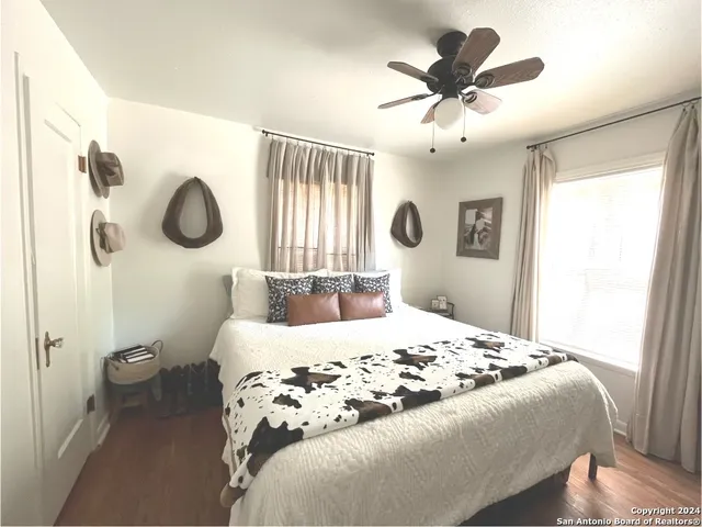 a bedroom with a bed and window