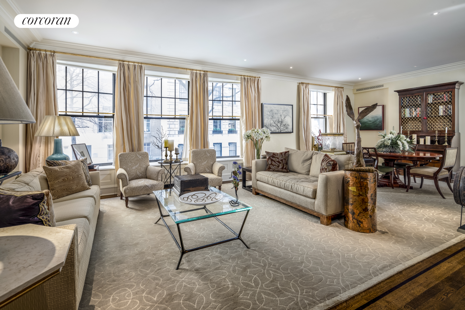 830 Park Avenue, Unit 1A Manhattan, NY 10021 - Photo 1 of 1 a living room with furniture and a large window