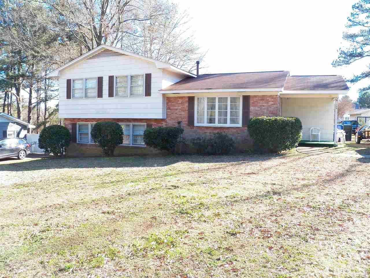 124 East Rowan Street Raleigh, NC 27609 - Photo 1 of 18 a front view of a house with a yard