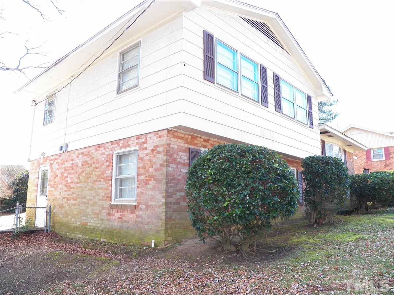 124 East Rowan Street Raleigh, NC 27609 - Photo 17 of 18 a view of a house with a yard
