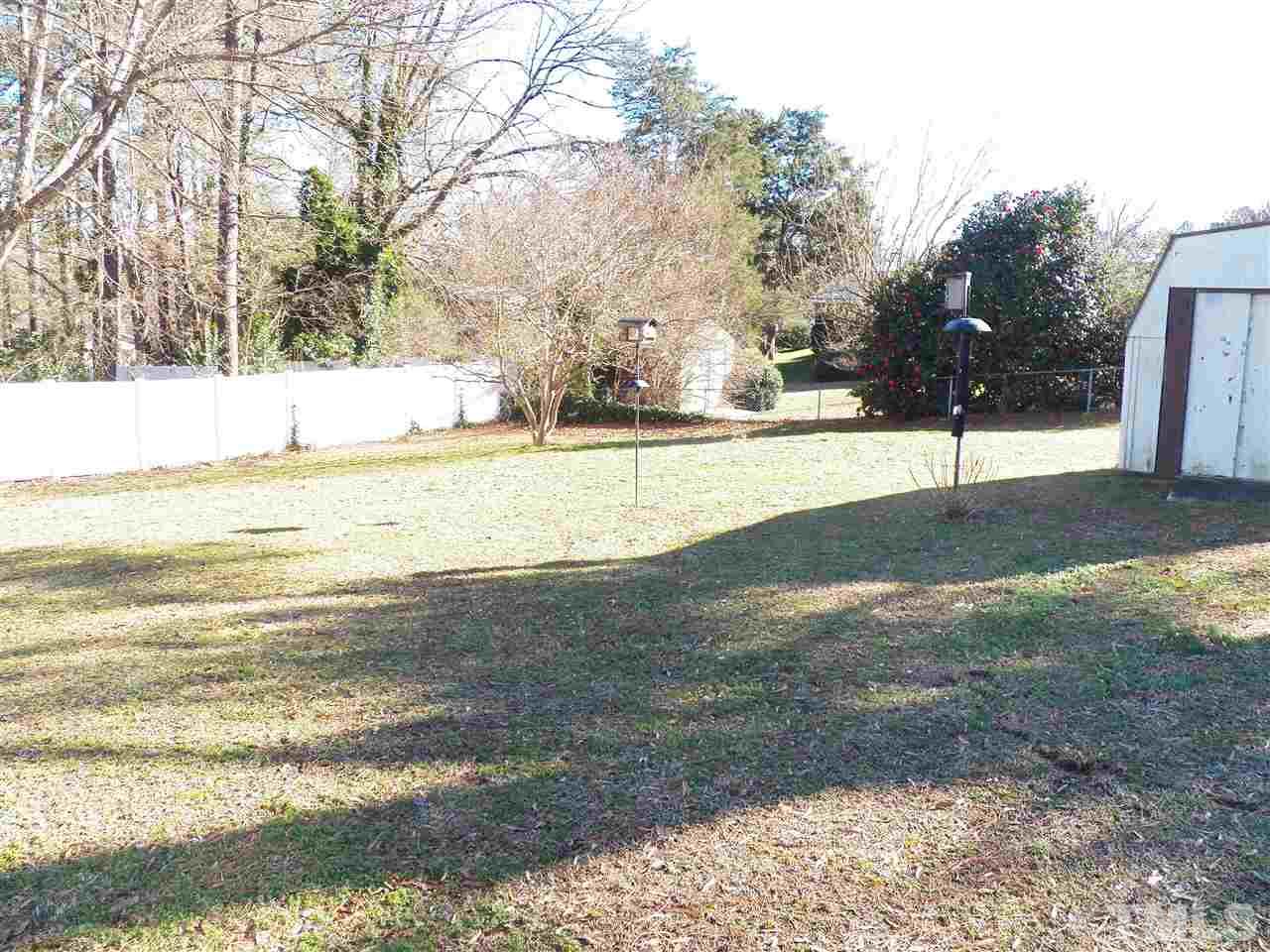 124 East Rowan Street Raleigh, NC 27609 - Photo 18 of 18 a view of large trees with yard