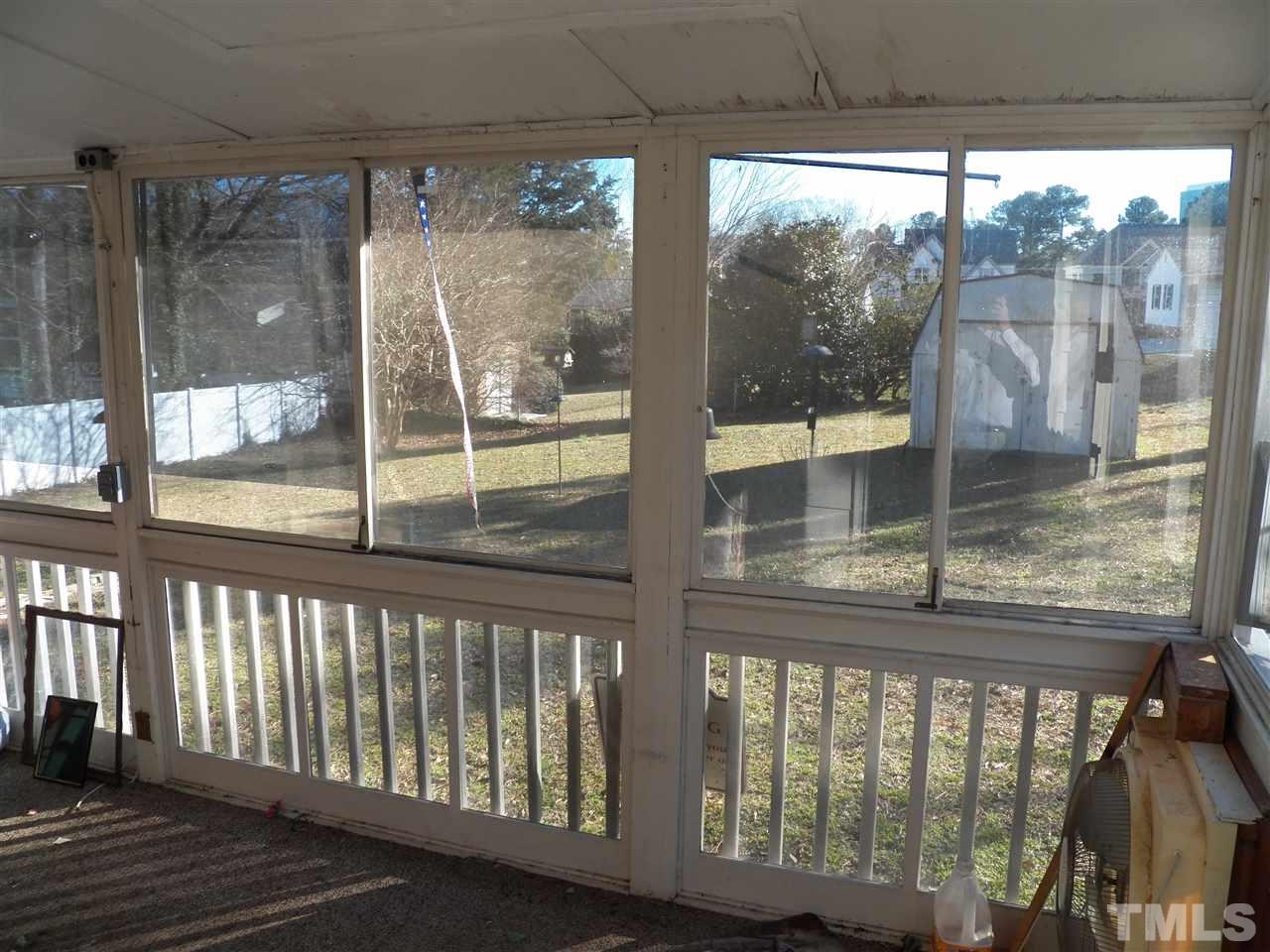 124 East Rowan Street Raleigh, NC 27609 - Photo 7 of 18 a view of a glass door with a from a porch