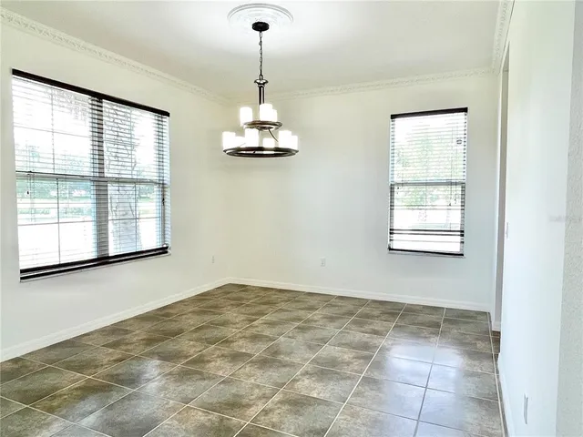 a view of empty room with windows