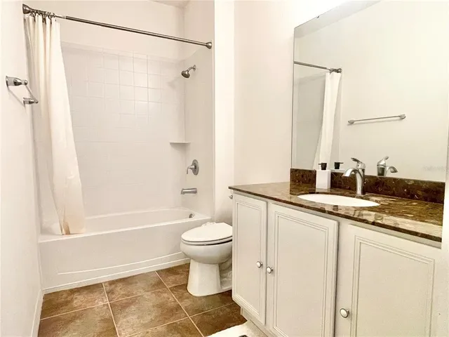 a bathroom with a sink a toilet and a bathtub