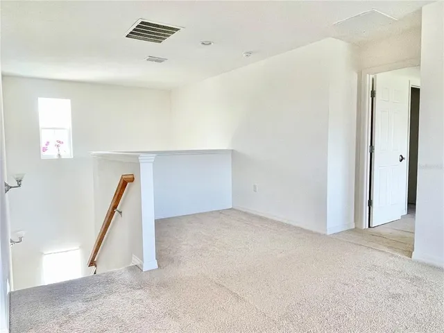 a view of a room with stairs