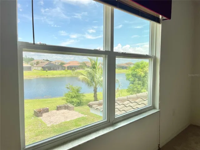 a view of a glass door with a large window