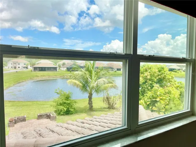 a spacious bathroom with a granite countertop sink and a mirror