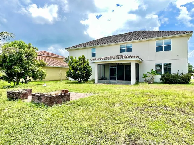 a view of a lake with a house in the background