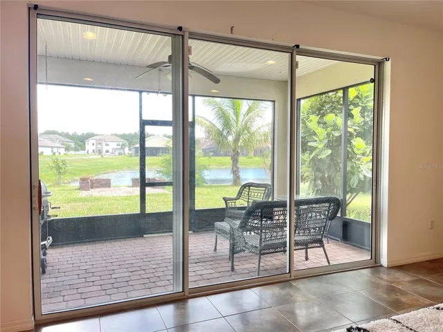 a living room with a large window and table