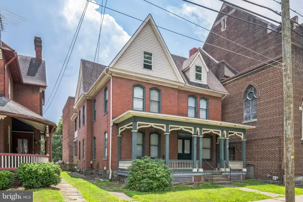 a view of a building with a yard