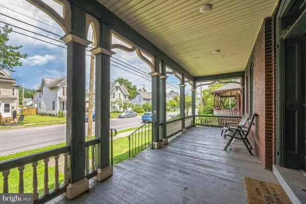 a view of a porch with wooden floor and outdoor space