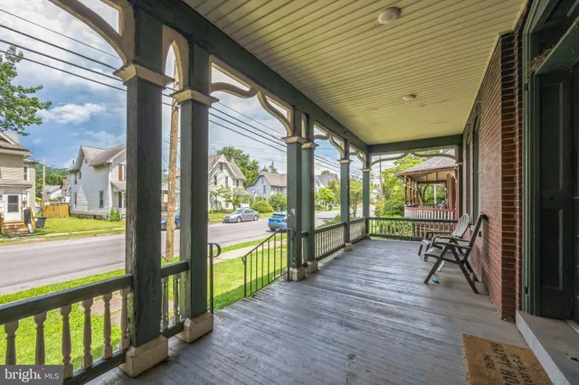 a view of a porch with wooden floor and outdoor space