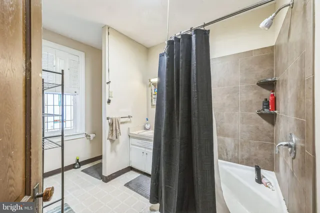 a bathroom with a shower and a tub
