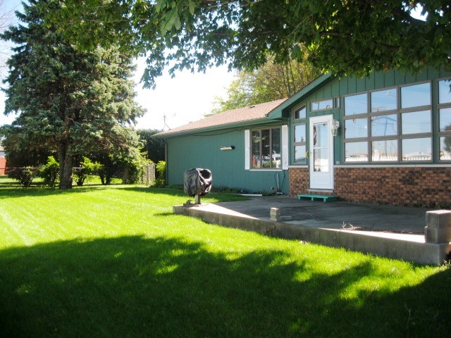 215 Linder Lane Rochelle, IL 61068 - Photo 19 of 19 a front view of a house with yard and green space
