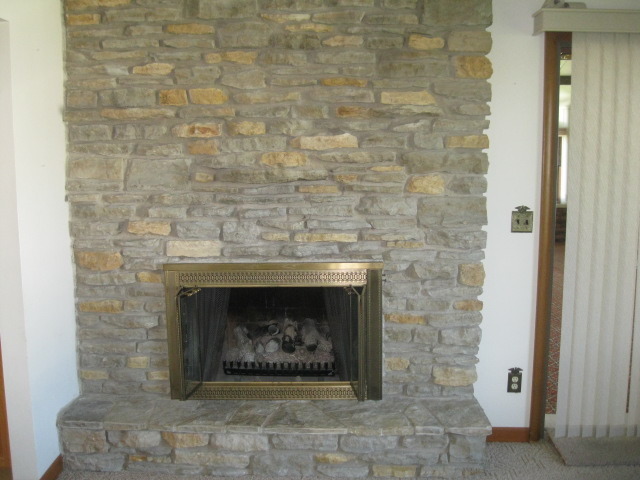215 Linder Lane Rochelle, IL 61068 - Photo 6 of 19 a an empty room with a fireplace