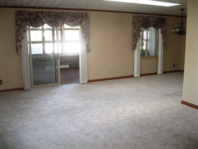 215 Linder Lane Rochelle, IL 61068 - Photo 7 of 19 an empty room with windows