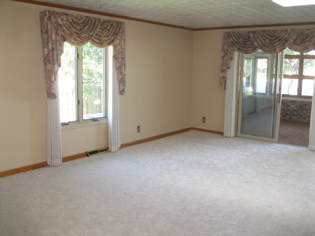 215 Linder Lane Rochelle, IL 61068 - Photo 9 of 19 an empty room with windows