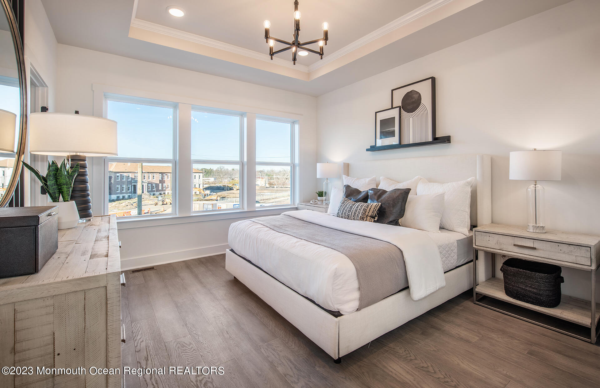 2 Sunset Oceanport, NJ 07757 - Photo 4 of 9 a bedroom with a large bed a chandelier and a window