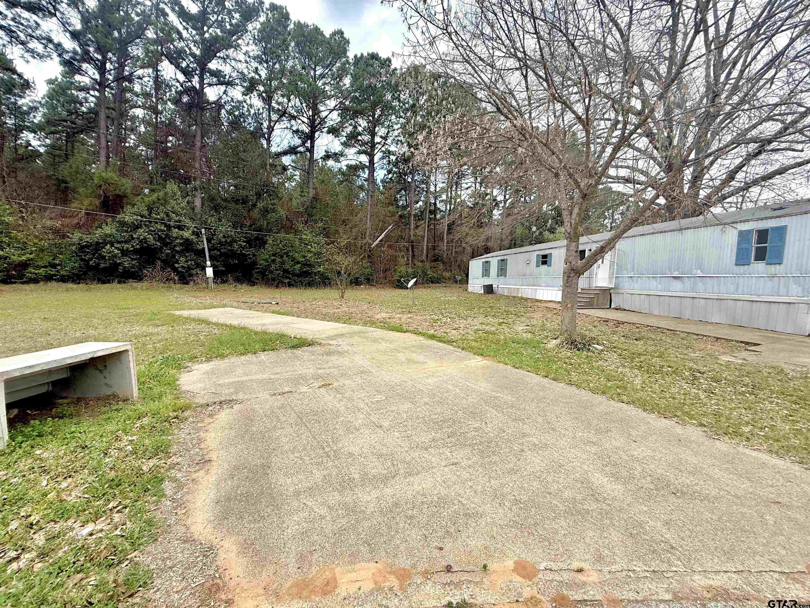 1111 Bassett Road Palestine, TX 75803 - Photo 1 of 8 a view of a yard with swimming pool