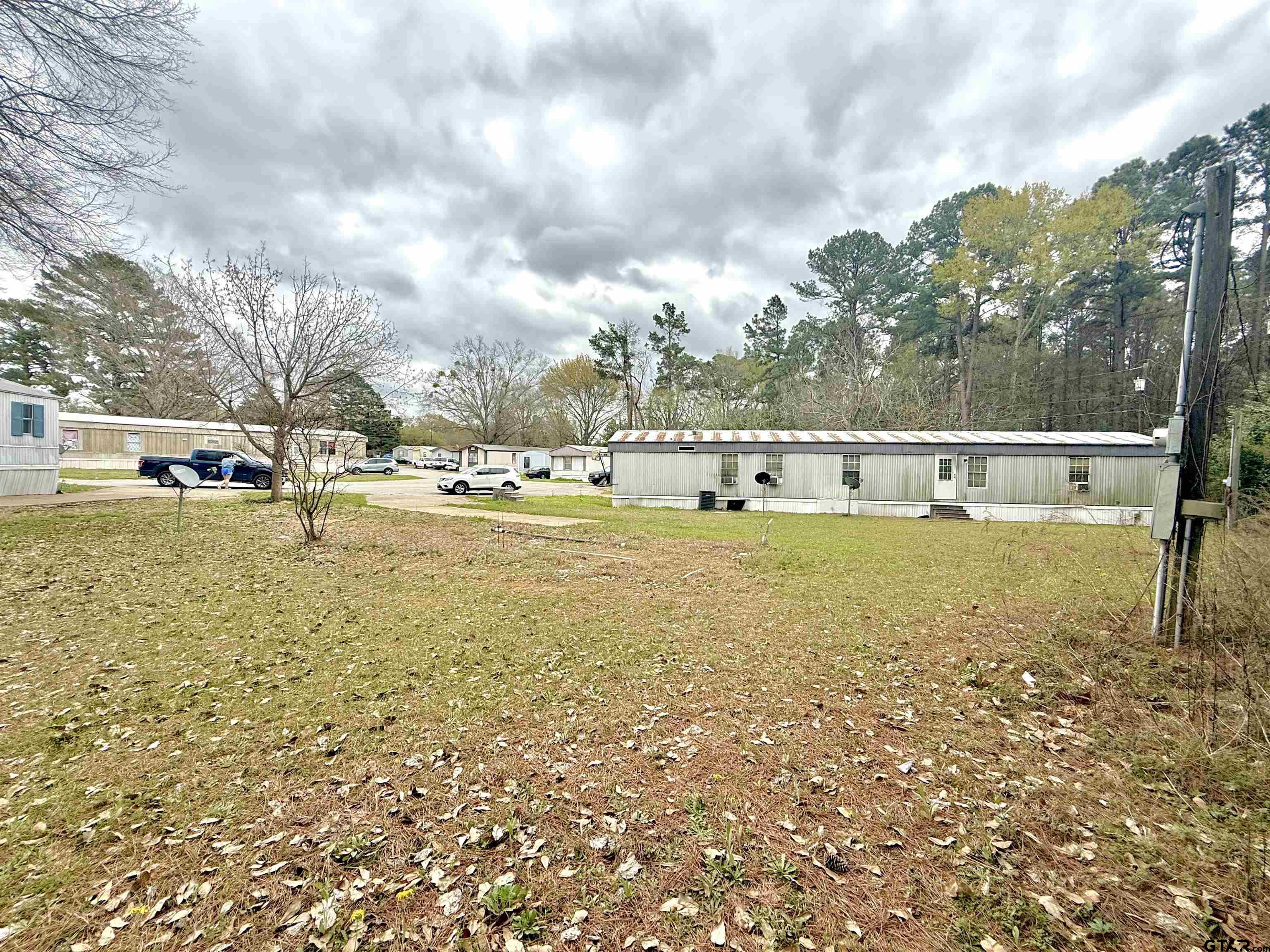 1111 Bassett Road Palestine, TX 75803 - Photo 3 of 8 a view of a lake with houses