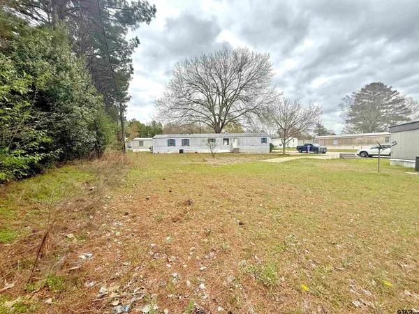 a view of a large body of water with a building in the background