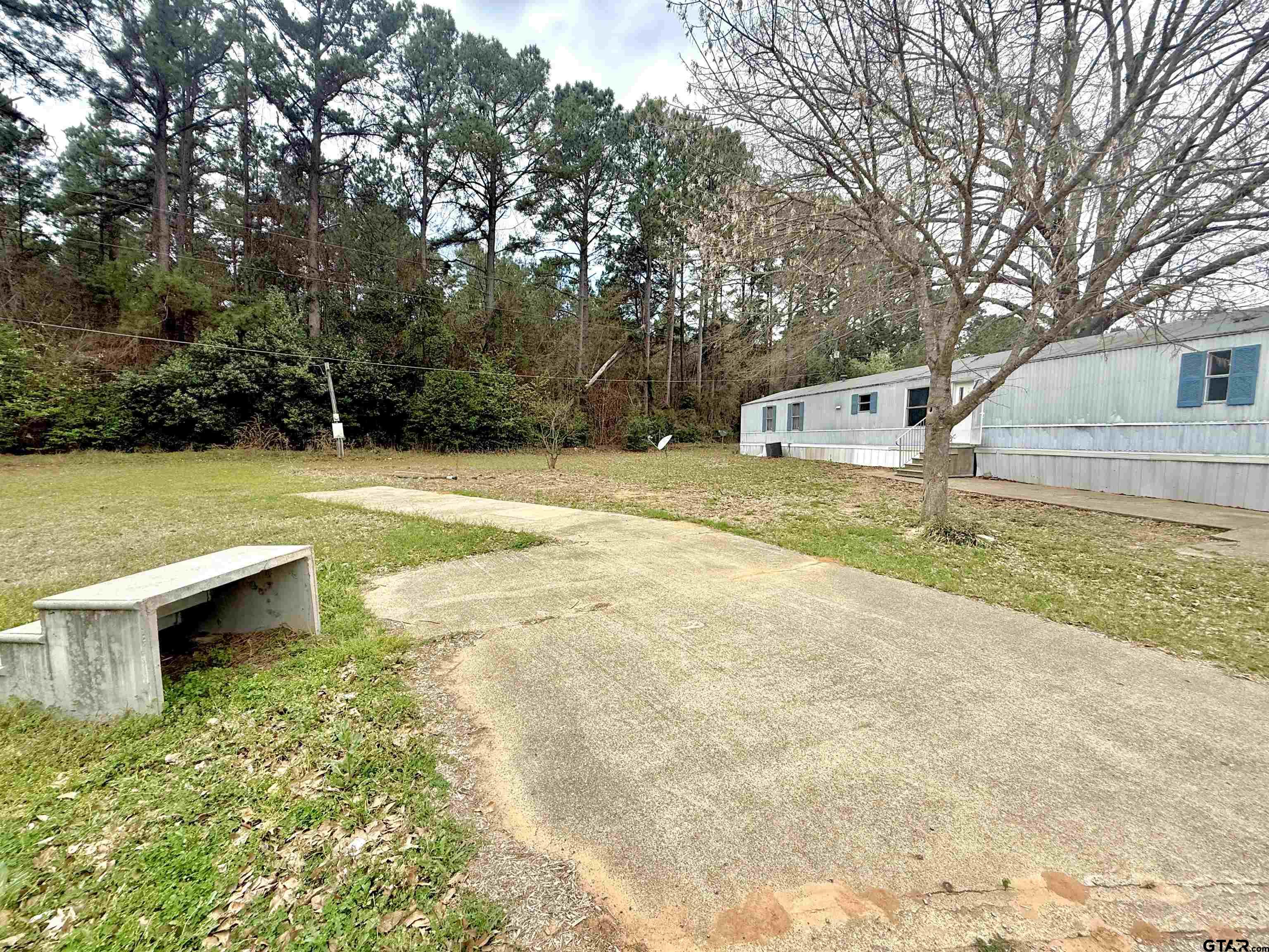 1111 Bassett Road Palestine, TX 75803 - Photo 5 of 8 a view of a yard with swimming pool