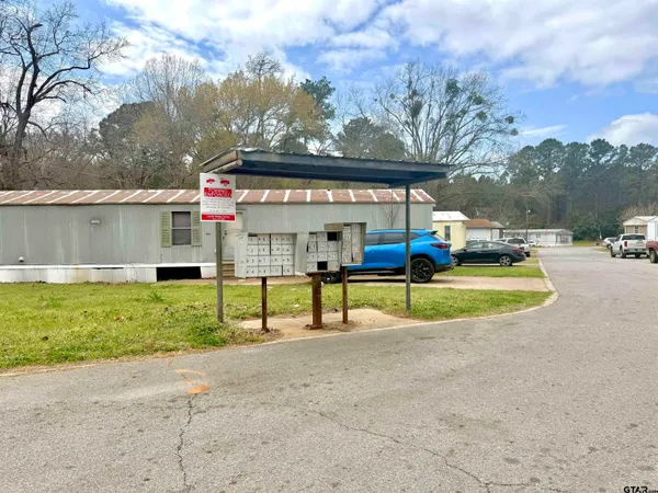 a view of swimming pool with a yard and sitting area