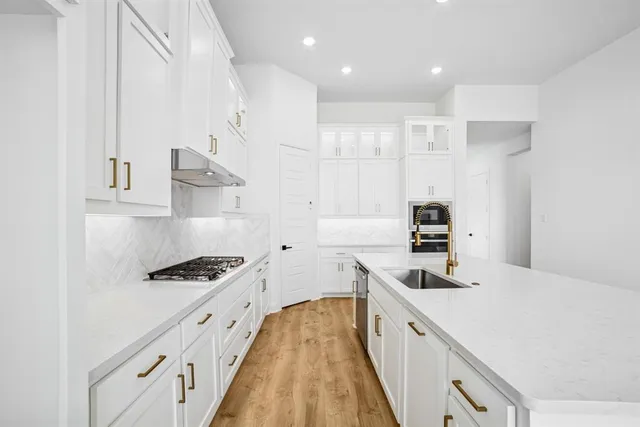 a view of an empty room with window and fireplace