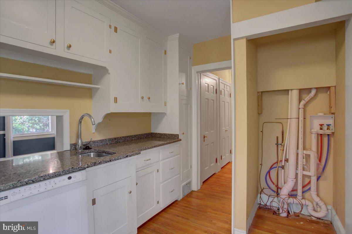 18902 Preston Road Hagerstown, MD 21742 - Photo 26 of 54 a spacious bathroom with a granite countertop sink and a mirror