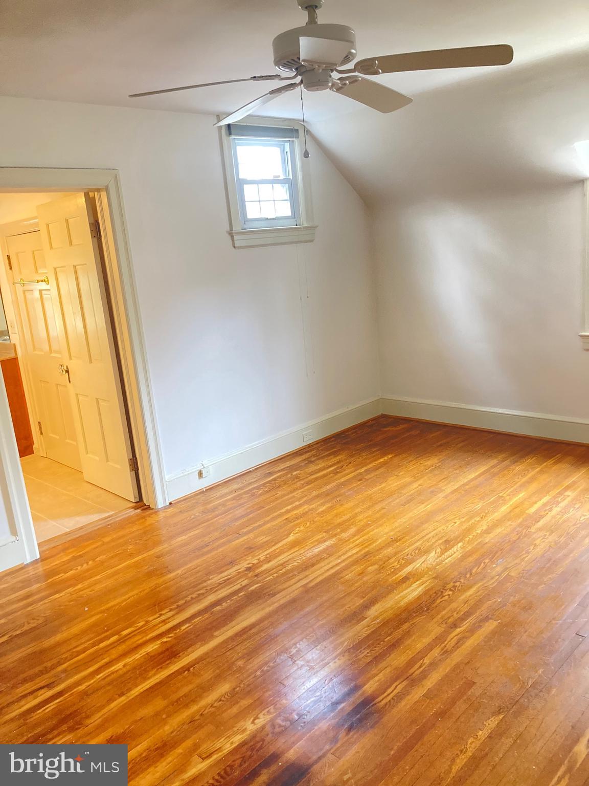 18902 Preston Road Hagerstown, MD 21742 - Photo 40 of 54 a view of an empty room with wooden floor and a window