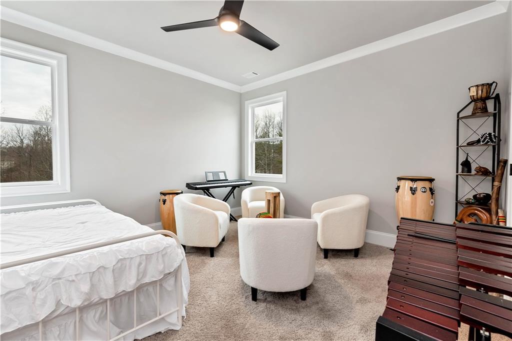 6140 Crescent Moon Ridge Cumming, GA 30041 - Photo 47 of 54 a bedroom with two beds and a large window