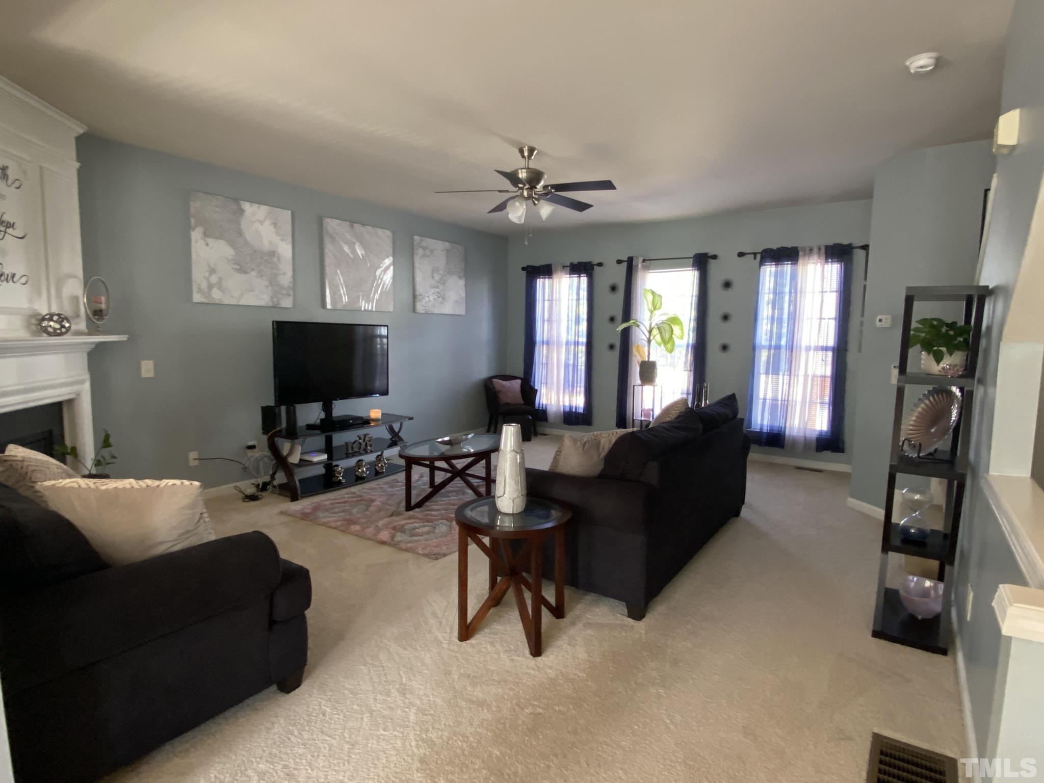 7251 Galon Glen Road Raleigh, NC 27613 - Photo 11 of 26 a living room with furniture and a flat screen tv
