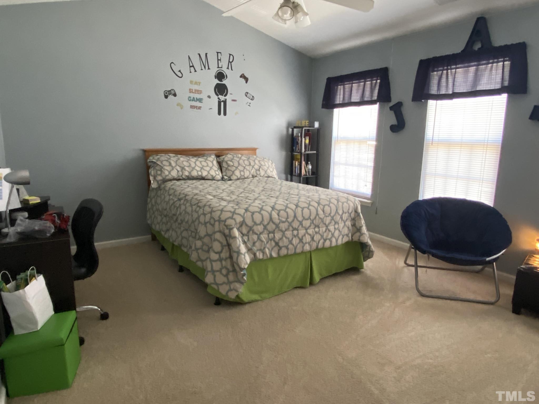 7251 Galon Glen Road Raleigh, NC 27613 - Photo 18 of 26 a bedroom with a bed and a window
