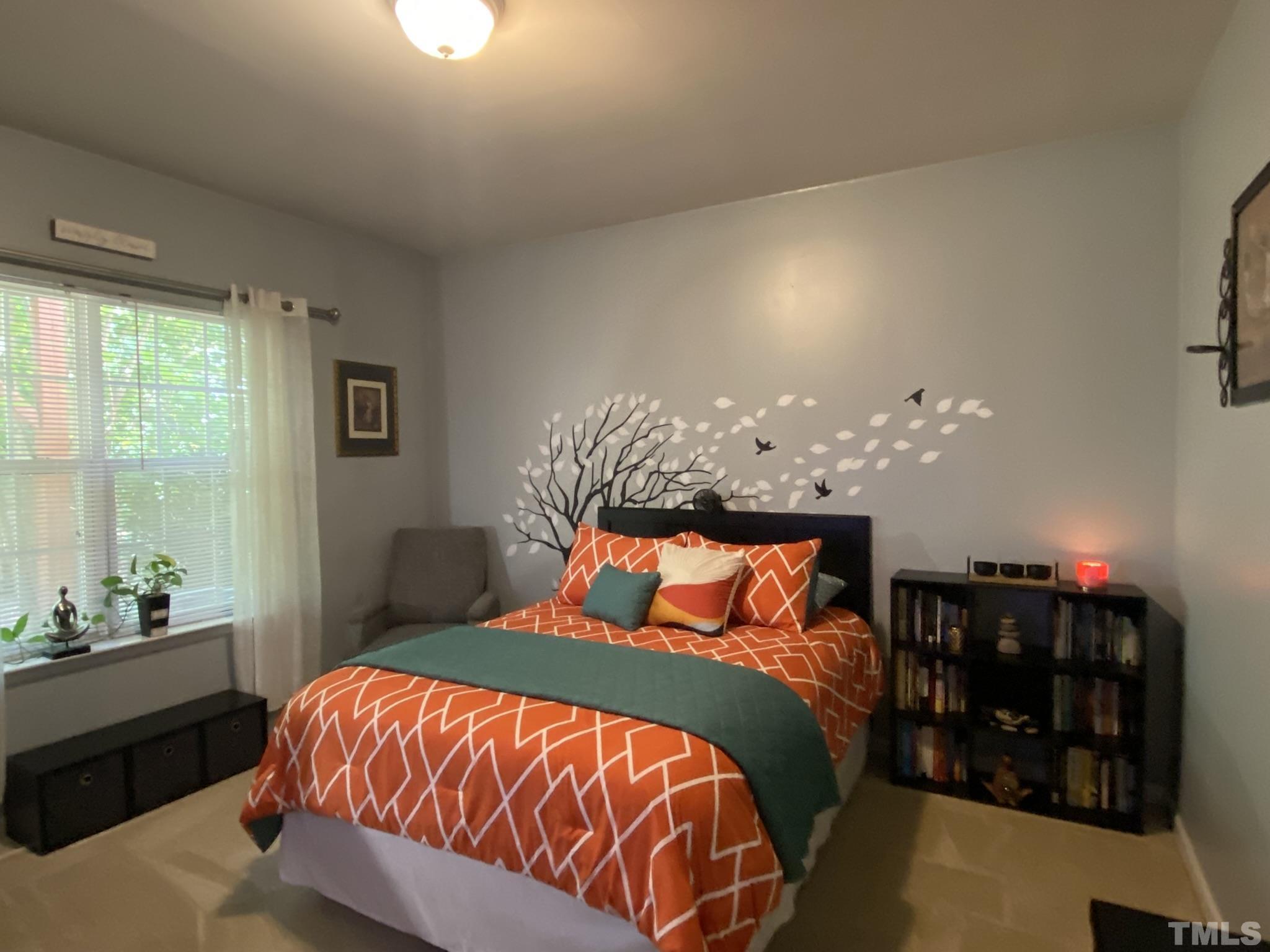 7251 Galon Glen Road Raleigh, NC 27613 - Photo 6 of 26 a bedroom with a bed and window