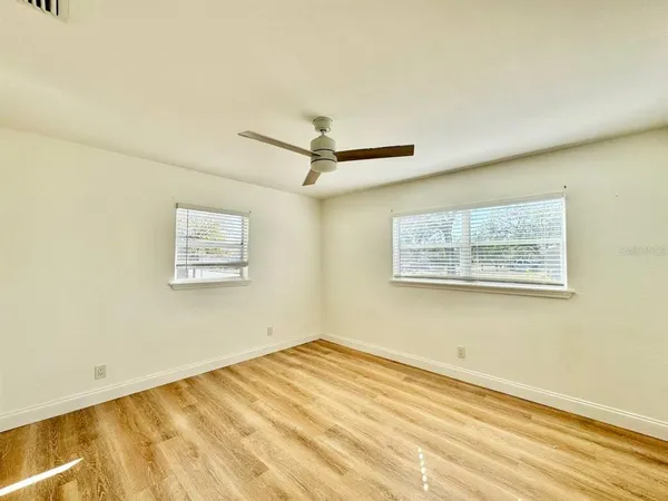 a view of a room with a wooden floor