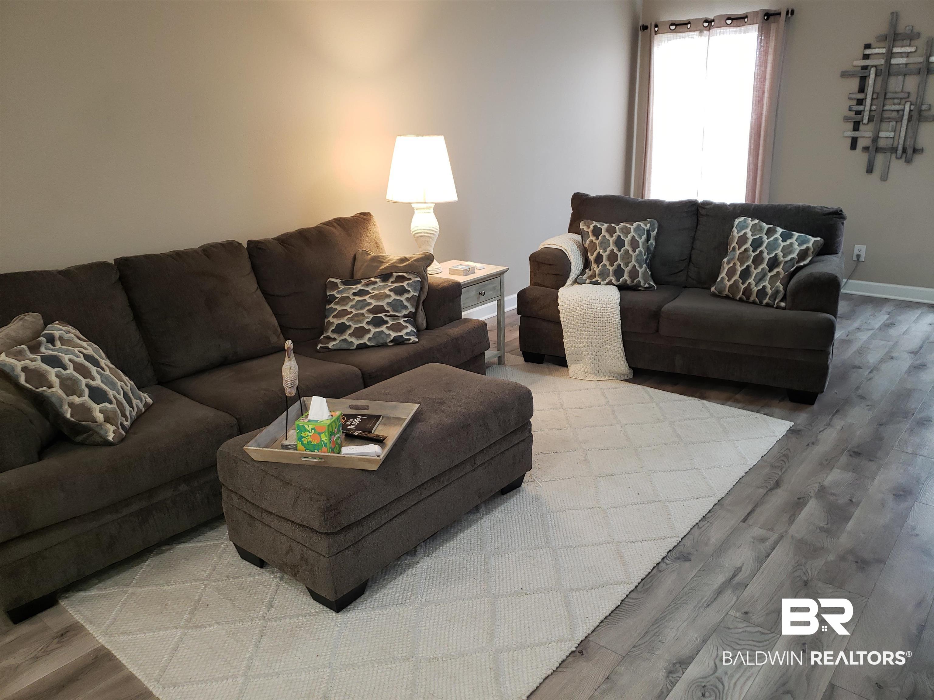 2006 Shelene Way, Unit 2006 Foley, AL 36535 - Photo 2 of 29 Living area with light wood-style LVP flooring