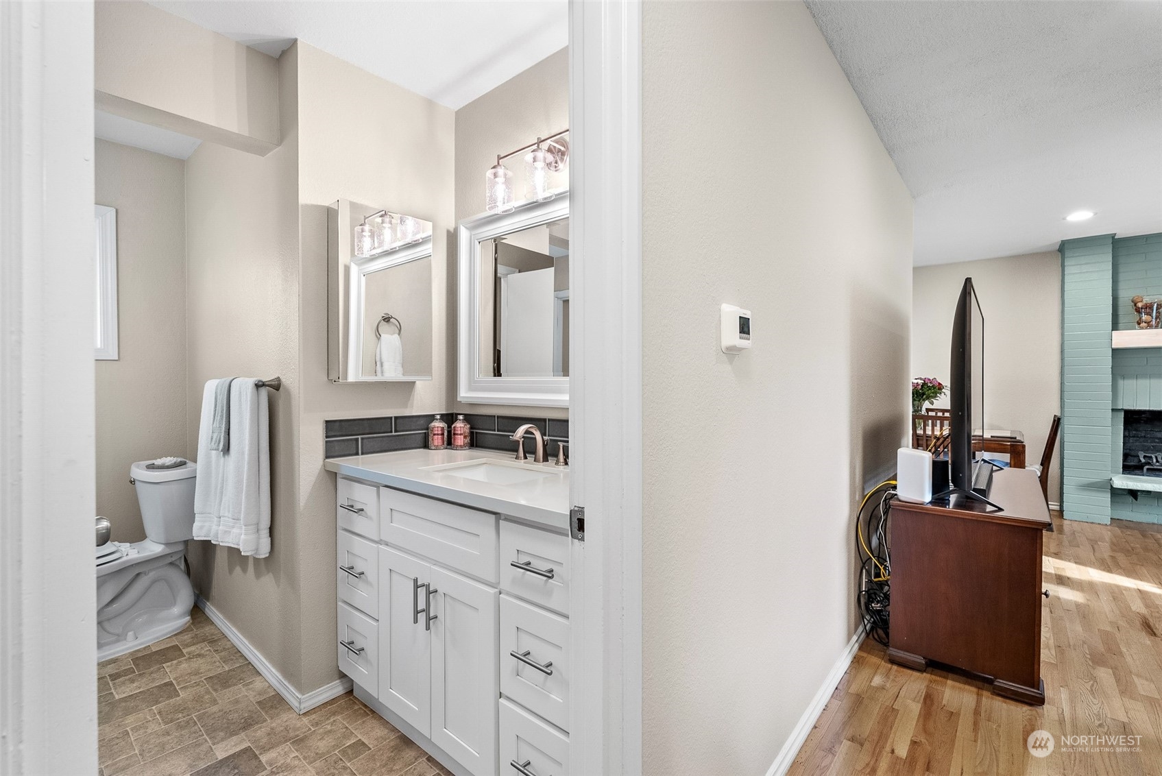 2313 Maple Lane Steilacoom, WA 98388 - Photo 17 of 40 a bathroom with a double vanity sink and a mirror