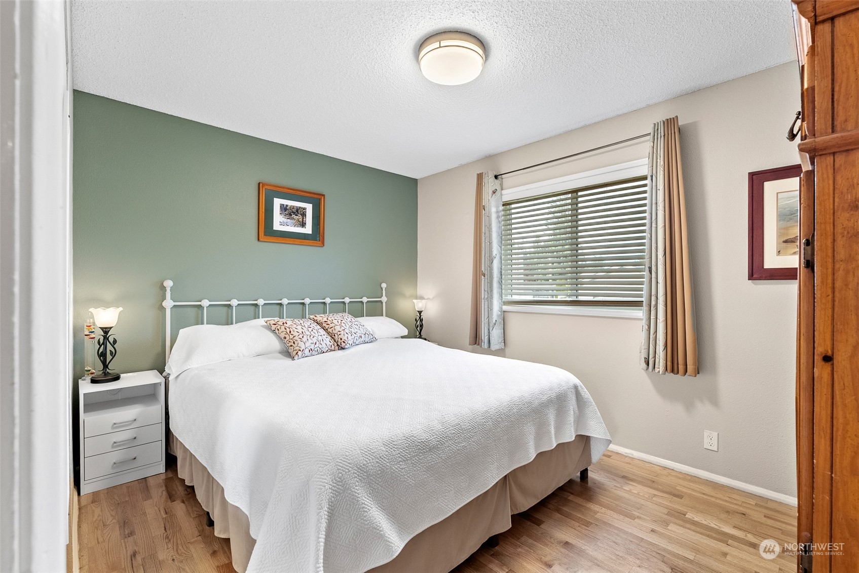 2313 Maple Lane Steilacoom, WA 98388 - Photo 19 of 40 a bedroom with a bed and a window