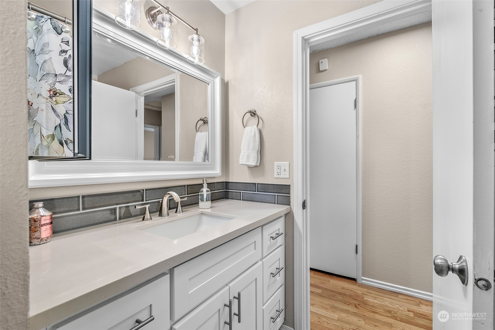 2313 Maple Lane Steilacoom, WA 98388 - Photo 21 of 40 a bathroom with a sink and a mirror