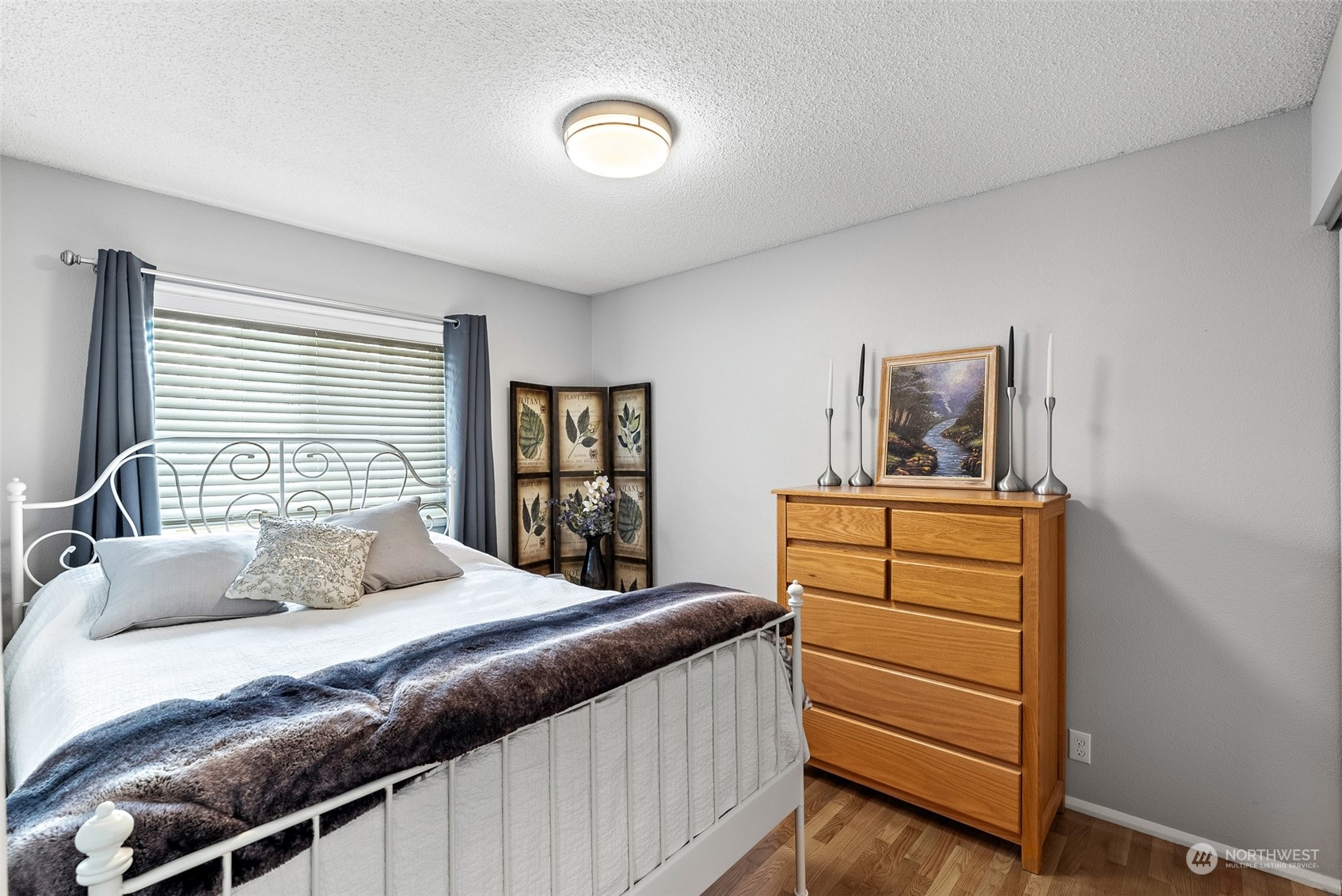 2313 Maple Lane Steilacoom, WA 98388 - Photo 24 of 40 a bedroom with a bed and a dresser