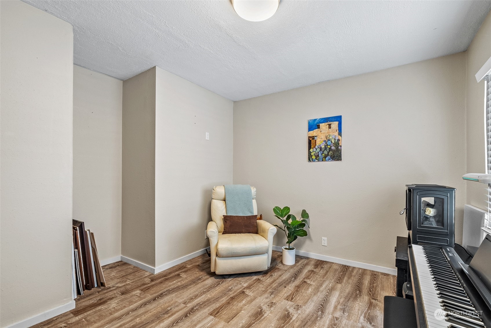 2313 Maple Lane Steilacoom, WA 98388 - Photo 29 of 40 a bedroom with a bed and wooden floor