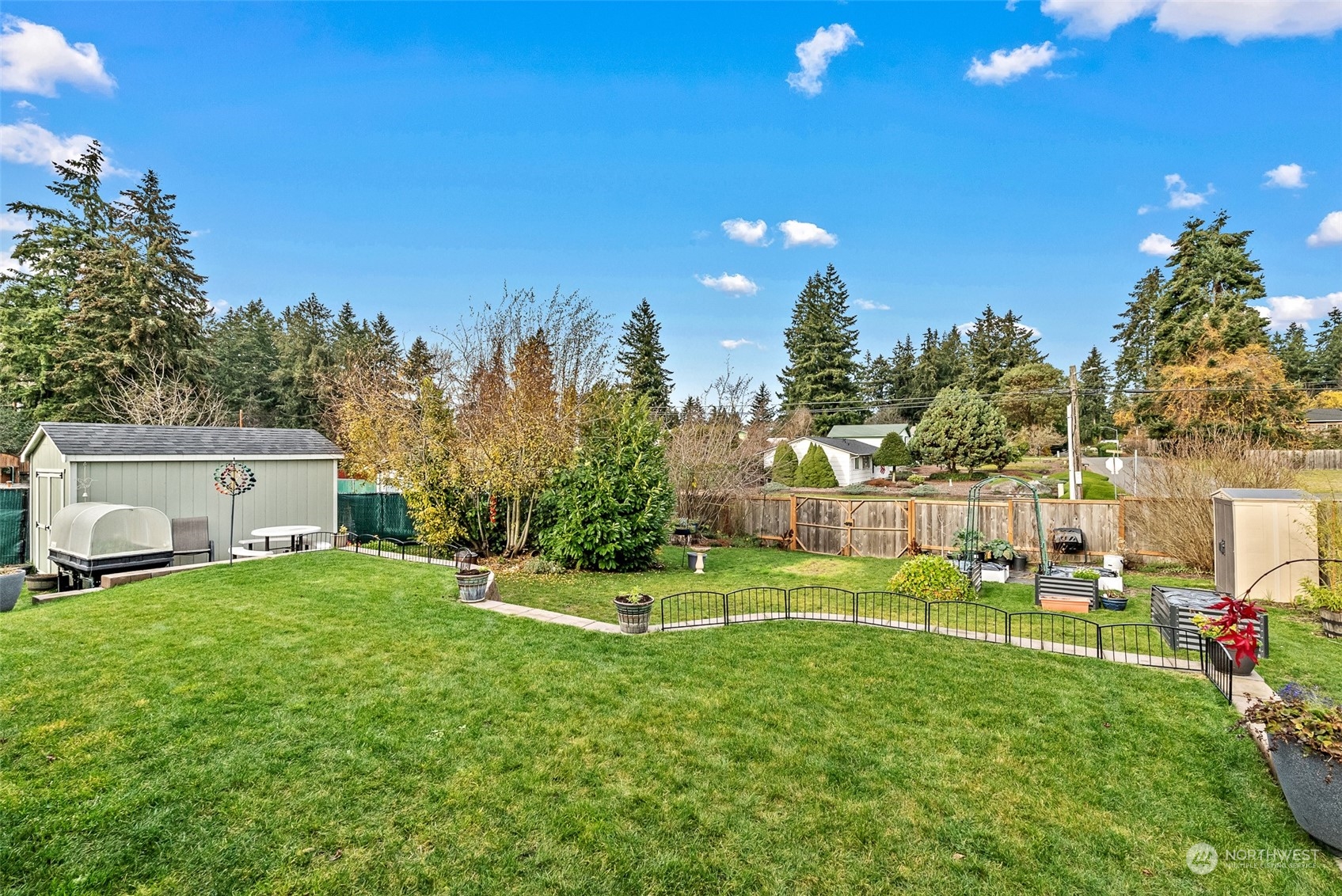 2313 Maple Lane Steilacoom, WA 98388 - Photo 33 of 40 a backyard of a house with lots of green space and outdoor seating