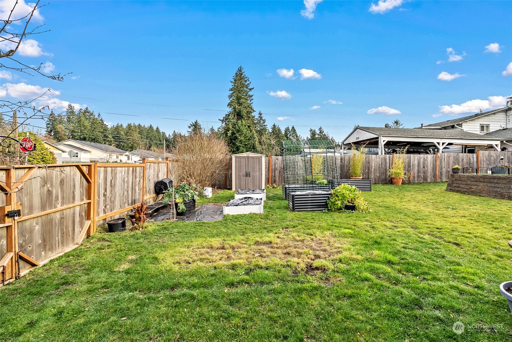 2313 Maple Lane Steilacoom, WA 98388 - Photo 34 of 40 a view of a house with backyard sitting area and garden