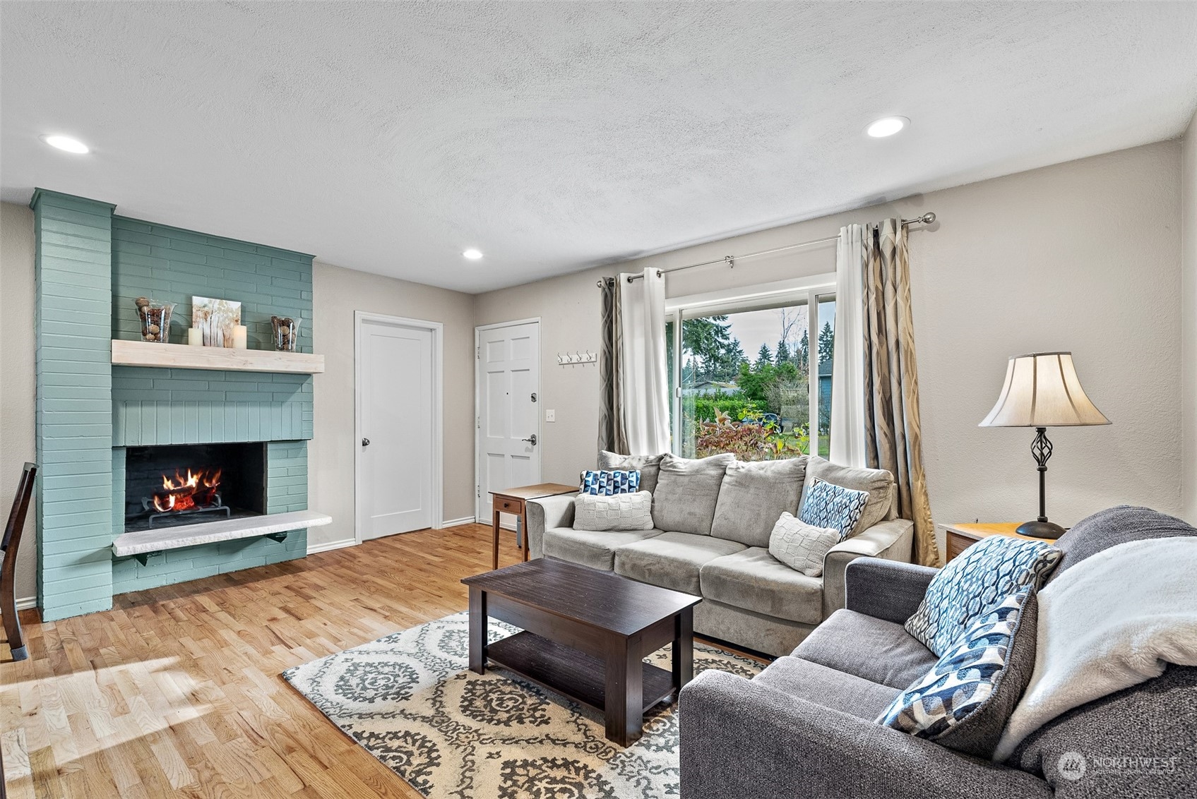 2313 Maple Lane Steilacoom, WA 98388 - Photo 5 of 40 a living room with furniture and a fireplace