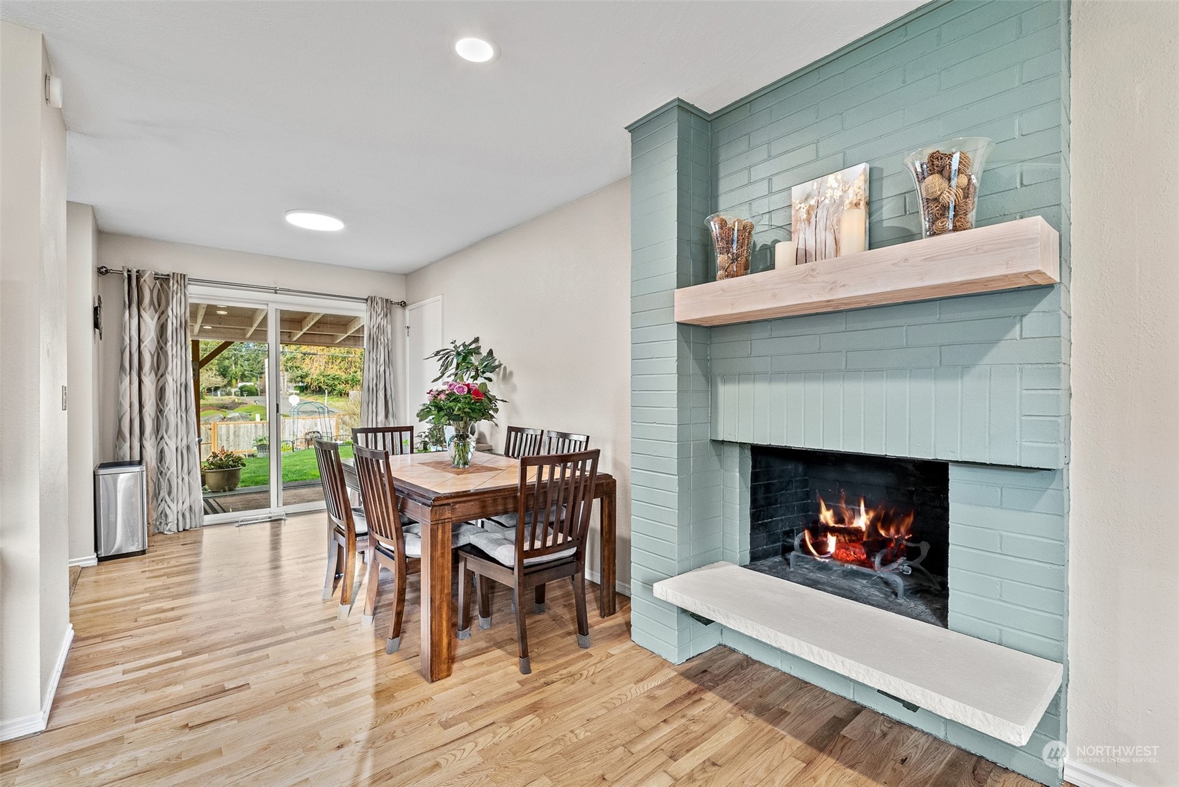 2313 Maple Lane Steilacoom, WA 98388 - Photo 8 of 40 a dining room with furniture and a fireplace