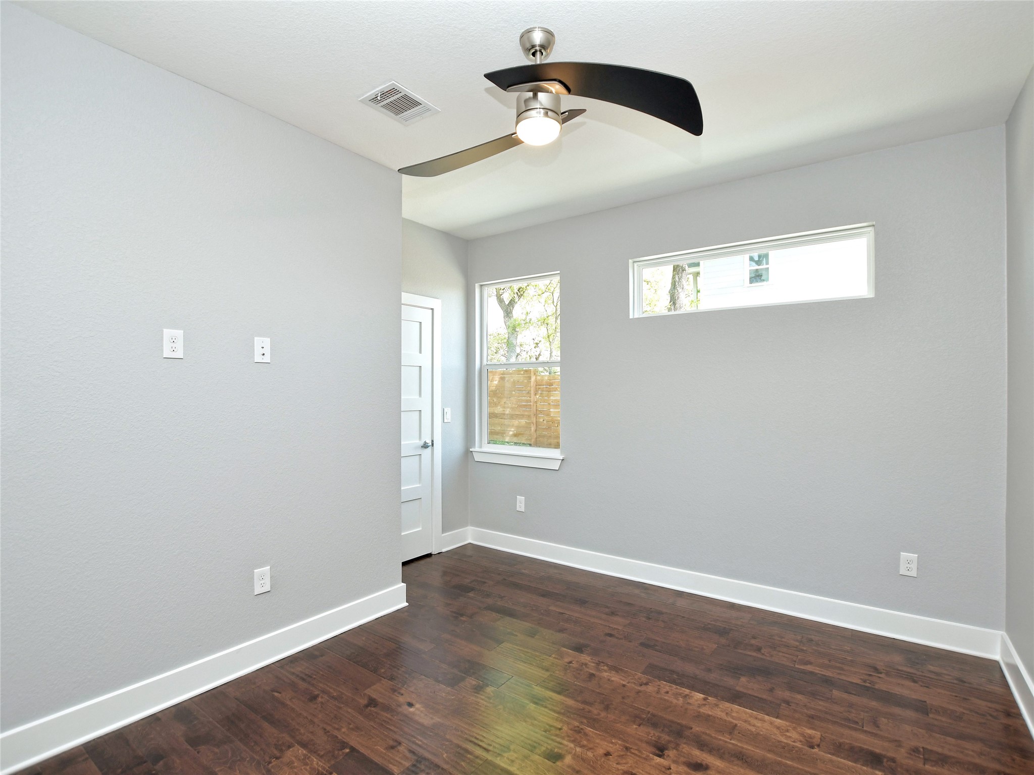 1130 Lott Avenue, Unit B Austin, TX 78721 - Photo 24 of 29 Spare room with dark wood-type flooring and a ceiling fan