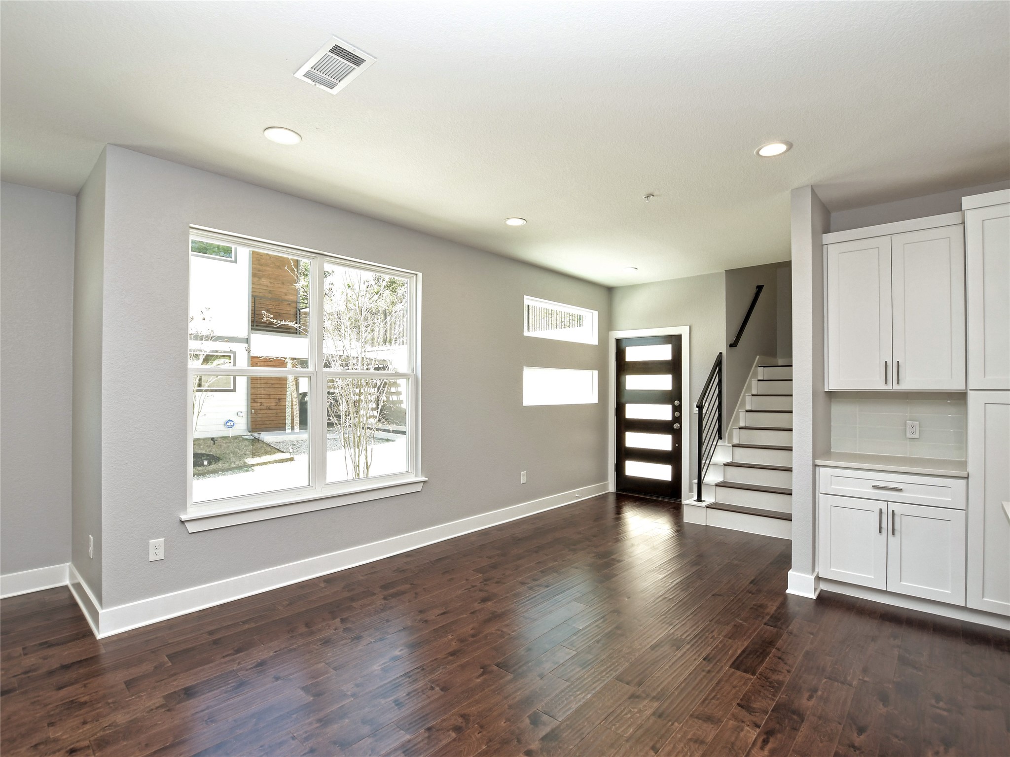 1130 Lott Avenue, Unit B Austin, TX 78721 - Photo 9 of 29 Foyer featuring dark wood-style floors and recessed lighting